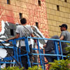 Shepard Fairey and crew painting a mural in South Park neighborhood of San Diego, July 15, 2010