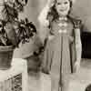 Shirley Temple at home, 19th Street, Santa Monica, modeling a Cinderella Frock