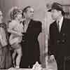 Larry Walker, Shirley Temple, James Dunn, and Alan Dinehart, Baby Take a Bow, 1934
