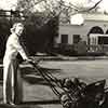 Alice Faye mowing the lawn, 1936 photo