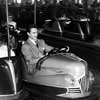 Photo of John Derek at Nu-Pike amusement park Skooter Bumper Cars, November 1953
