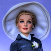 Franklin Mint Grace Kelly vinyl doll wearing Arrival In Monaco outfit