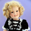 Danbury Mint Shirley Temple doll by Elke Hutchens wearing 1982 Ideal Heidi dress