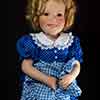 Danbury Mint porcelain doll by Elke Hutchens wearing Susannah of the Mounties dress up outfit