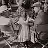 Lionel Barrymore, Shirley Temple, and David Butler during filming of The Little Colonel, 1935